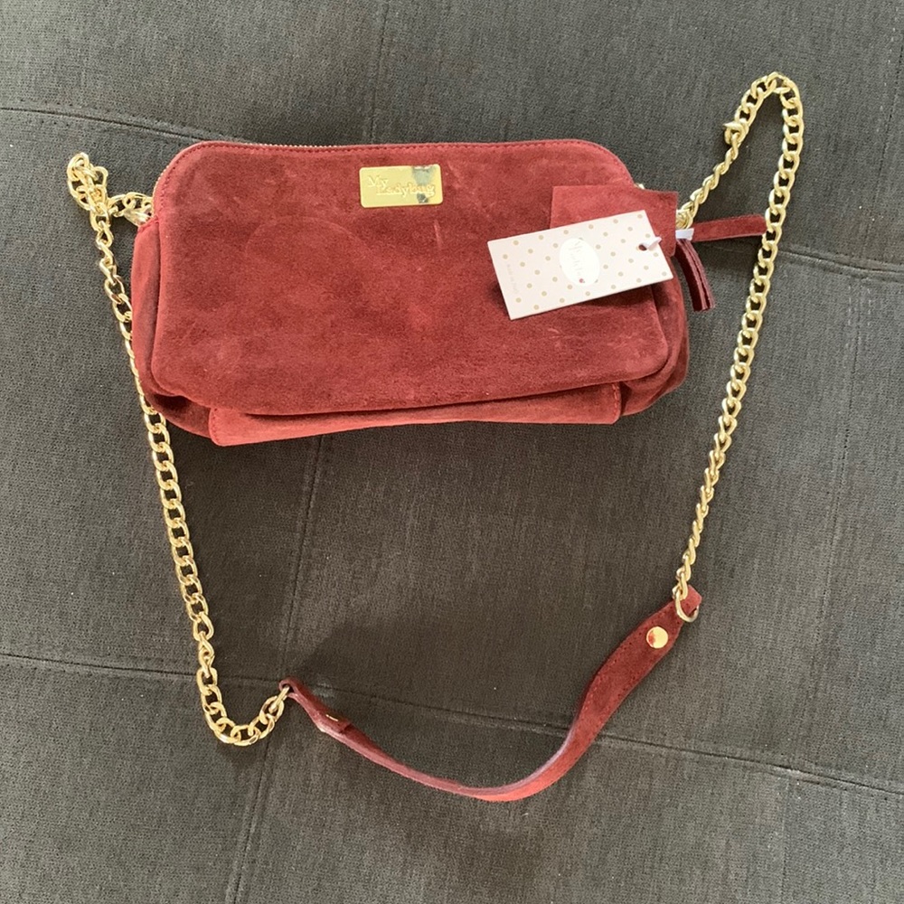 New with tags soft leather purse. Maroon/Merlot color